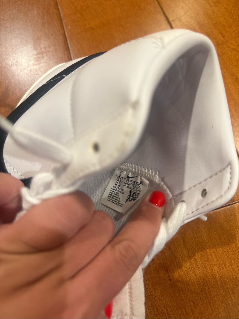 Nike White High-Top Sneakers with Black Swoosh - Picture 9 of 13